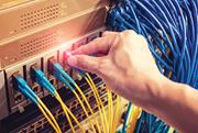 Fiber-optic cables in network server room.