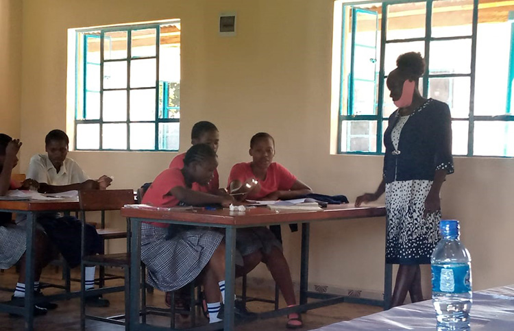 Celline Omondi facilitates a secondary classroom in Kenya.