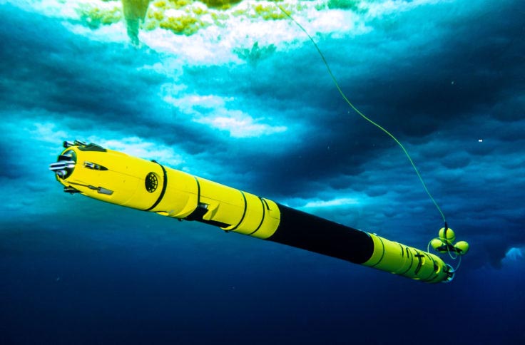A yellow and black, torpedo-like submersible.