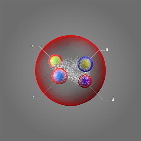 Artist's representation of a tetraquark showing a red spherical shell around four smaller spheres of differing colors