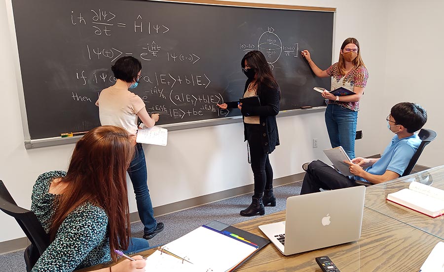 Students studying quantum mechanics