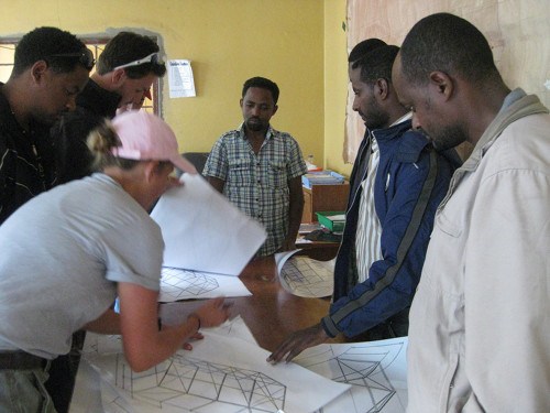 EWB engineers review plans for new market stalls with Addis Alem municipal leaders. CREDIT: Catherine O'Riordan
