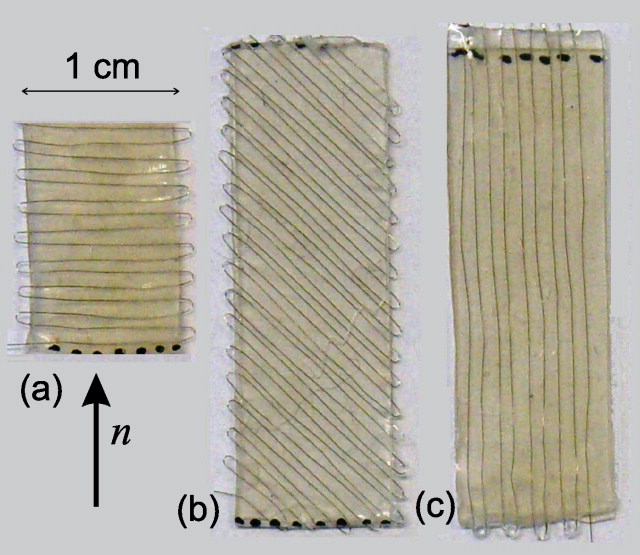 Mechanical bistability in liquid crystal elastomerwire composite