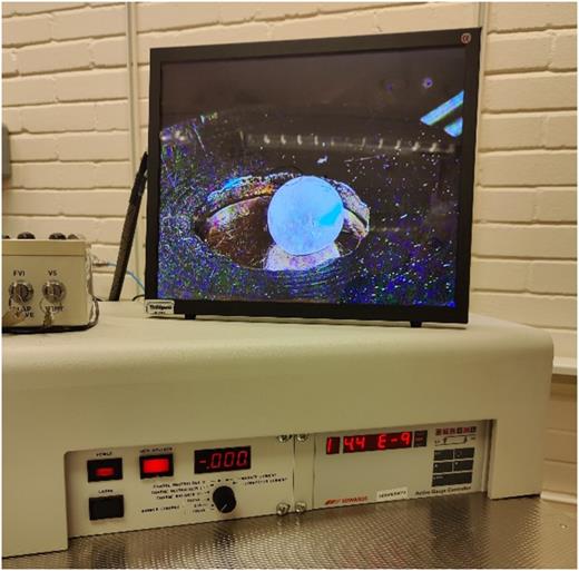 Image of fast-frozen 6 μl drop of aqueous solution with viruses in the analysis chamber. Vacuum ∼4.4 × 10−9 Torr.
