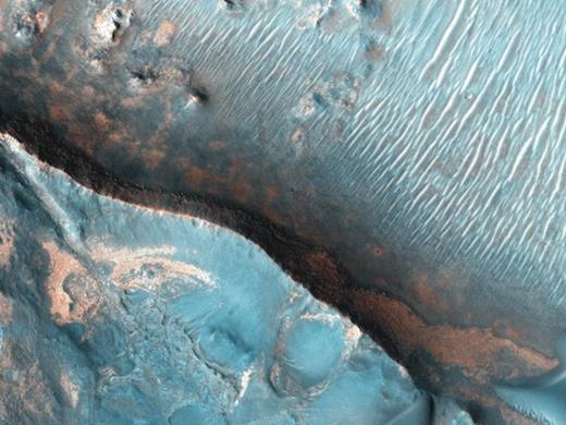 . Sedimentary rocks on Mars, known to contain hydrogen and oxygen, may be candidates for future visits to the planet as a means to study past environments that could have supported life. One such region is the mineral-rich Nili Fossae, photographed in 2007 by the HiRISE camera on the Mars Reconnaissance Orbiter mission.