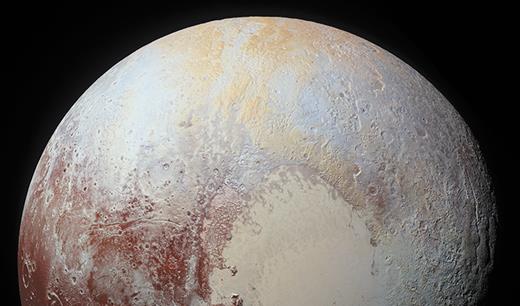 . The dwarf planet Pluto, photographed by the New Horizons spacecraft.