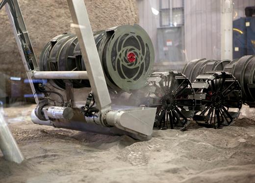 . A robotic rover is tested in a bin of simulated space dirt at NASA’s Kennedy Space Center in Florida. The robot is called RASSOR 2.0—the Regolith Advanced Surface Systems Operations Robot.