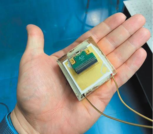Figure 1. The terahertz quantum cascade laser and thermoelectric cooler shown here are all the equipment necessary for the portable laser developed by Qing Hu and his colleagues. The compact design opens up potential applications, such as security scans for drugs and skin cancer screening. (Photo courtesy of Qing Hu and colleagues, MIT.)