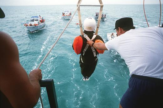 Ride prepares to drop from a 15-foot-high platform during an astronaut training exercise on parachute water landings in 1978. (Photo by SSgt Bill Stephenson, Homestead Air Force Base/National Archives photo no. 6377279.)